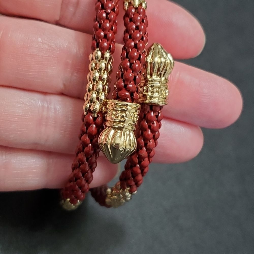 Gold tone and reddish brown wrap bracelet